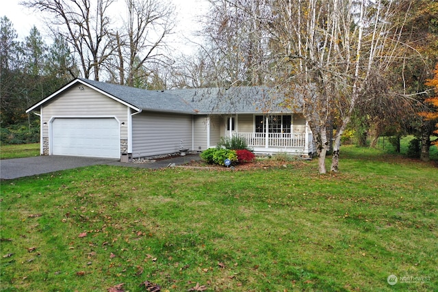 single story home featuring a garage, covered porch, and a front yard