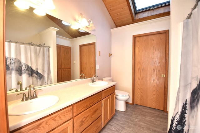 bathroom with wooden ceiling, hardwood / wood-style flooring, lofted ceiling with skylight, vanity, and toilet