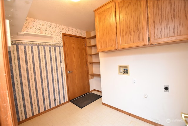 laundry room with hookup for a washing machine, cabinets, and hookup for an electric dryer