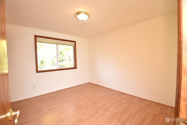 unfurnished room featuring light hardwood / wood-style flooring