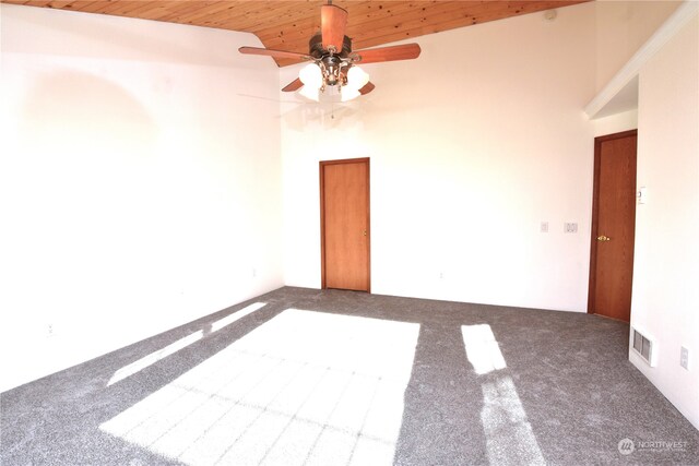 unfurnished room with high vaulted ceiling, ceiling fan, carpet, and wood ceiling