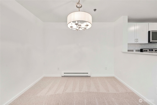 unfurnished dining area with baseboard heating and light carpet