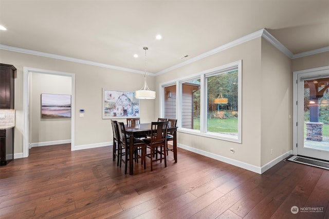 dining room with dark wood-type flooring and ornamental molding