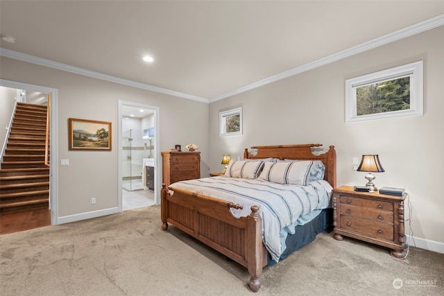 bedroom with connected bathroom, light colored carpet, and ornamental molding