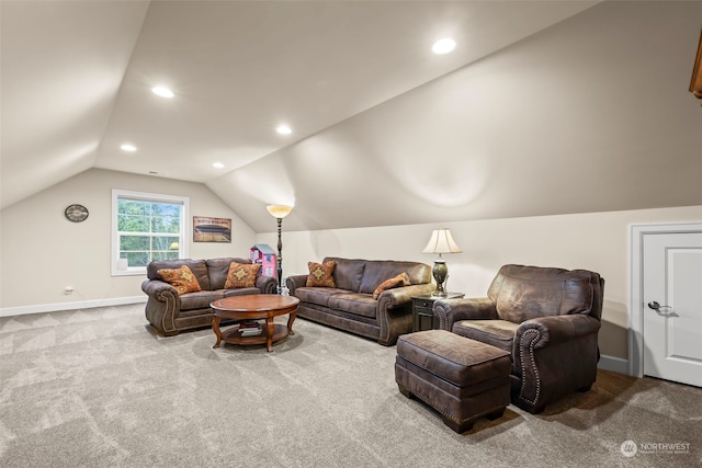 living room featuring carpet and lofted ceiling