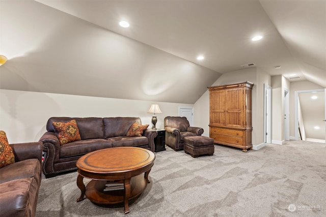 living room with light carpet and vaulted ceiling