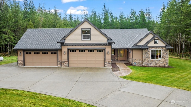 28330 318th Dr SE, Ravensdale, WA 98051 - craftsman-style house with stone siding, concrete driveway, an attached garage, and a front lawn