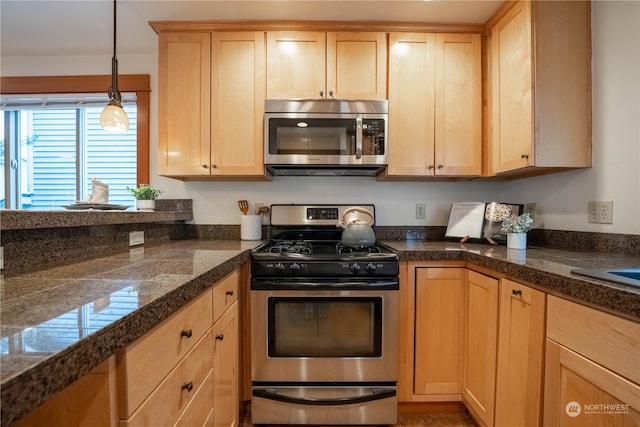 kitchen featuring light brown cabinets and appliances with stainless steel finishes