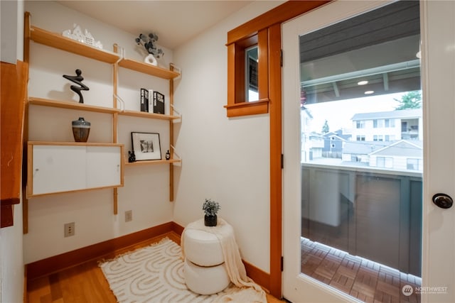 doorway with hardwood / wood-style floors