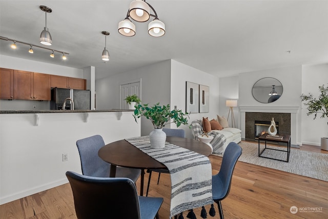 dining space featuring light wood-type flooring