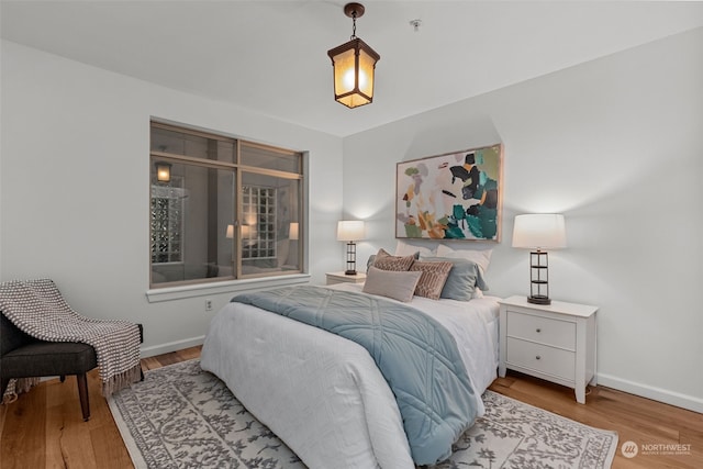 bedroom with light hardwood / wood-style flooring