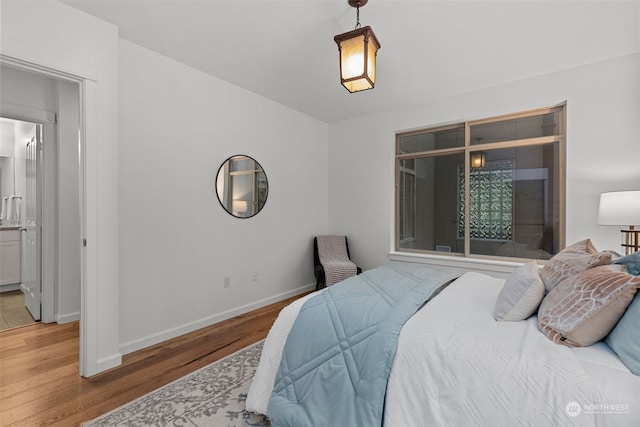 bedroom with hardwood / wood-style floors