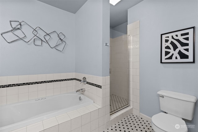 bathroom featuring toilet, tile patterned floors, and separate shower and tub