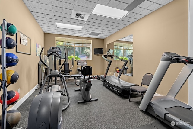 workout area with a drop ceiling