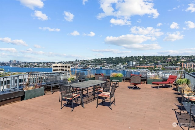 wooden terrace featuring a water view