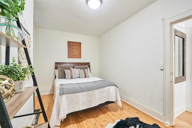 905 NE 43rd St Unit 108, Seattle, WA 98105 - bedroom with wood-type flooring and baseboards