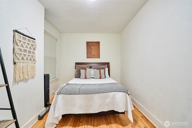 905 NE 43rd St Unit 108, Seattle, WA 98105 - bedroom featuring wood finished floors and baseboards