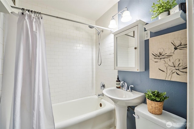 905 NE 43rd St Unit 108, Seattle, WA 98105 - full bath with a textured wall, toilet, and shower / tub combo