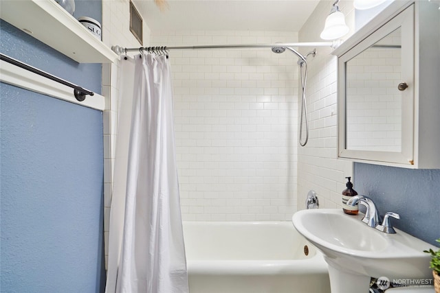 905 NE 43rd St Unit 108, Seattle, WA 98105 - bathroom with a sink and shower / bath combo with shower curtain