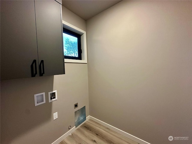 clothes washing area with hookup for a washing machine, cabinets, hookup for an electric dryer, light hardwood / wood-style floors, and gas dryer hookup