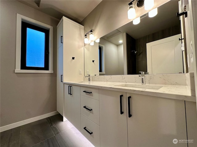 bathroom with tile patterned flooring and vanity