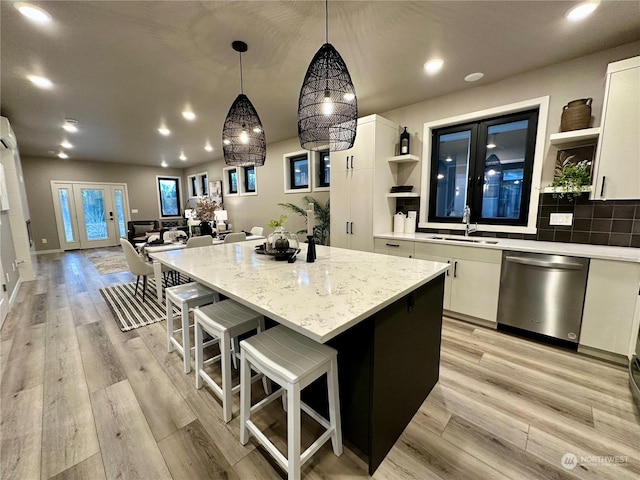 4286 Creston Way, Bellingham, WA 98226 - kitchen featuring open shelves, stainless steel dishwasher, a center island, recessed lighting, and white cabinets