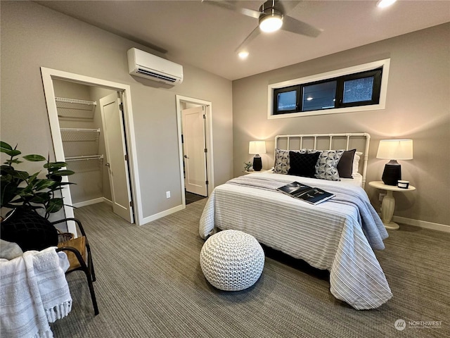 carpeted bedroom featuring an AC wall unit, ceiling fan, and a closet