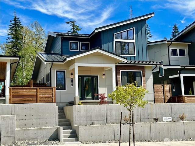 4286 Creston Way, Bellingham, WA 98226 - modern home with a fenced front yard, board and batten siding, metal roof, and a standing seam roof