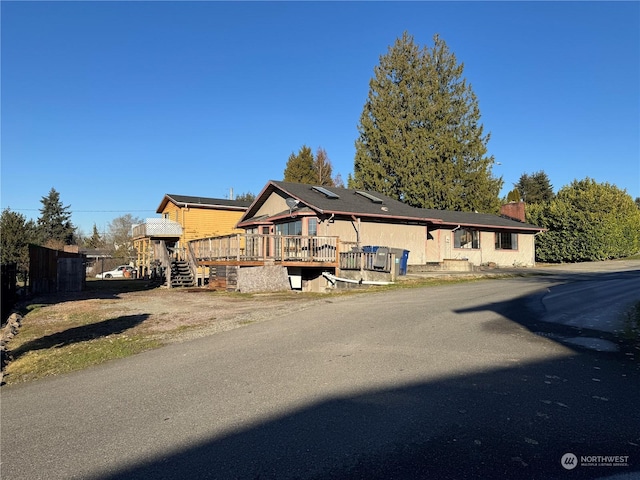 view of front of house with a wooden deck