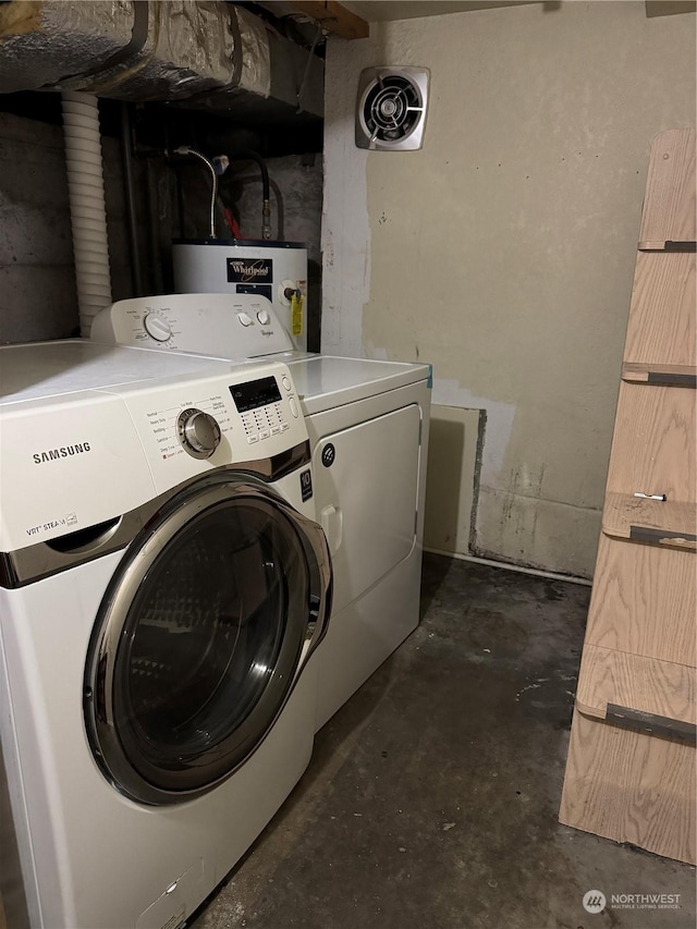 washroom featuring water heater and washer and clothes dryer