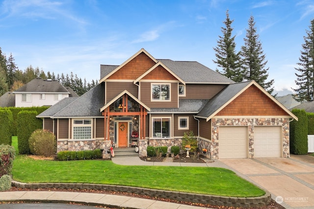 craftsman-style house featuring a garage and a front lawn