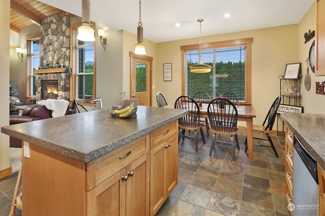 kitchen featuring a fireplace, wooden ceiling, dishwasher, a center island, and hanging light fixtures