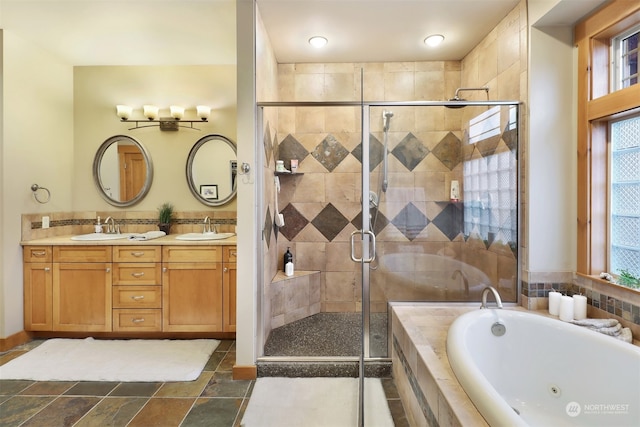 bathroom featuring vanity and separate shower and tub