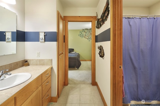 bathroom with tile patterned flooring and vanity