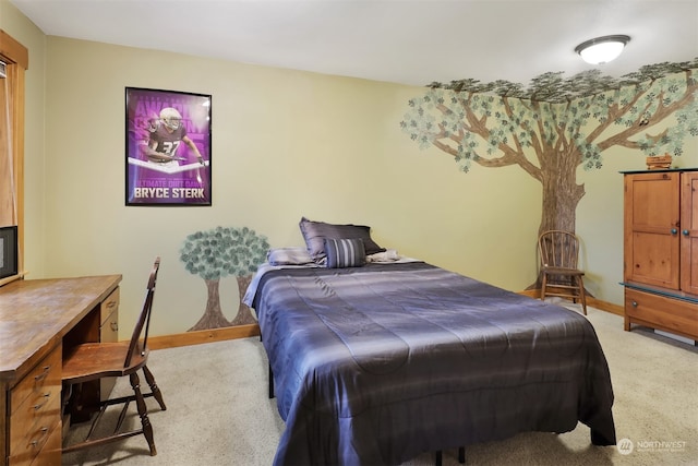 bedroom featuring light carpet