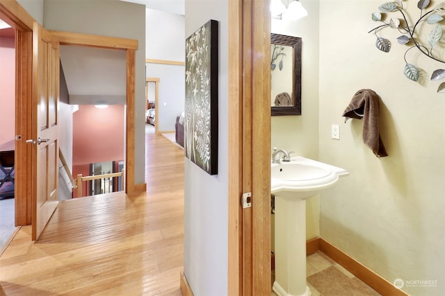 bathroom with hardwood / wood-style flooring