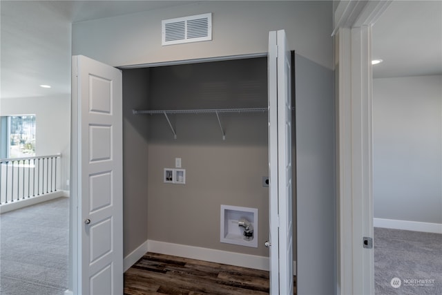 laundry room featuring dark hardwood / wood-style flooring and hookup for a washing machine