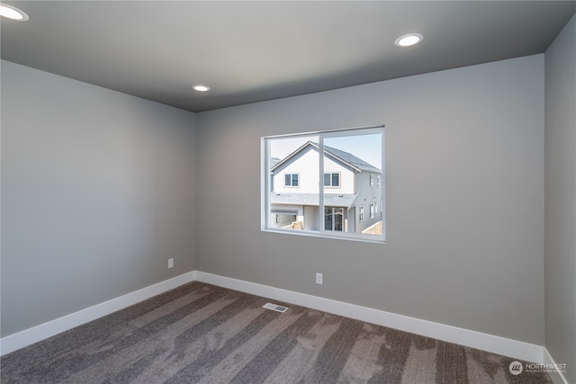 spare room with carpet floors