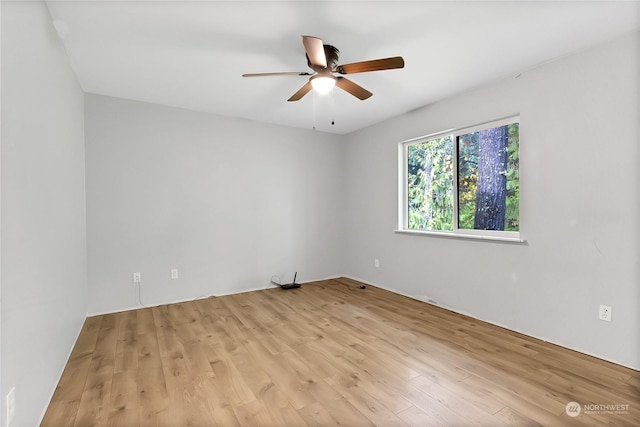 22222 Bluewater Dr SE, Yelm, WA 98597 - unfurnished room featuring a ceiling fan and light wood-style flooring