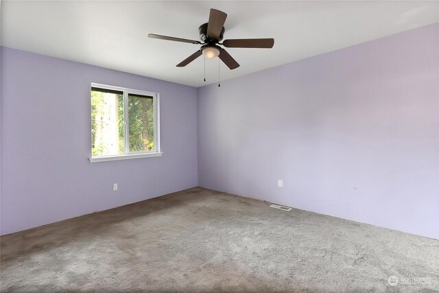 22222 Bluewater Dr SE, Yelm, WA 98597 - carpeted spare room with ceiling fan