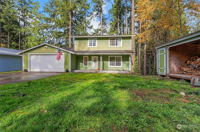 view of front of house featuring a garage, an outdoor structure, a front lawn, and a porch