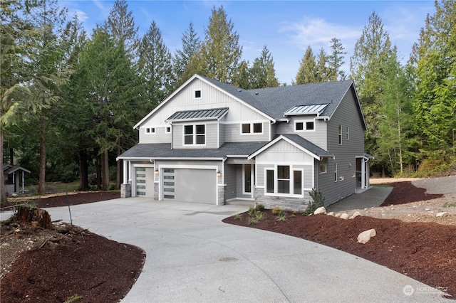 view of front of home with central AC and a garage