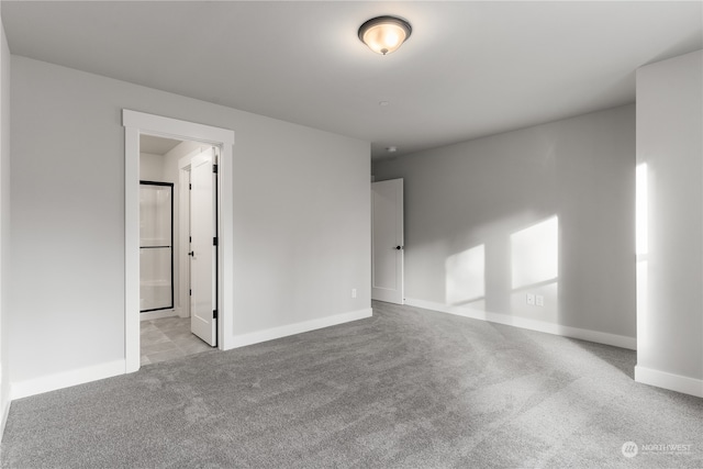 empty room featuring light colored carpet