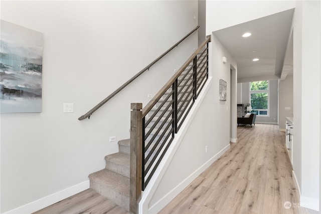 stairway featuring hardwood / wood-style floors