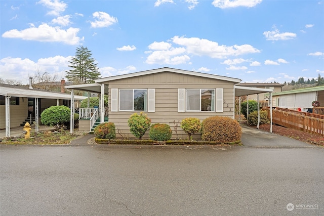 manufactured / mobile home featuring a carport