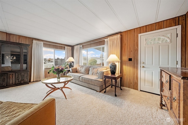 living room featuring wooden walls and carpet