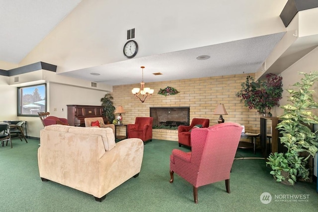 living room featuring dark colored carpet, a chandelier, high vaulted ceiling, a brick fireplace, and brick wall