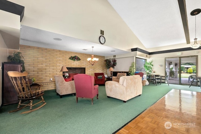 living room with high vaulted ceiling, brick wall, a brick fireplace, parquet flooring, and a chandelier