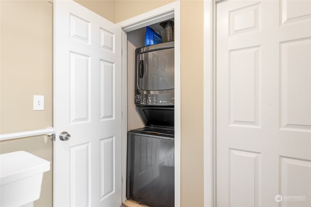 laundry area with stacked washer and clothes dryer