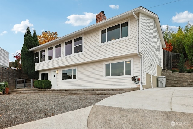 rear view of house with a garage